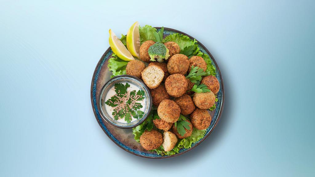 Falafel Fritters (3 Pcs) · Mashed chickpea prepared with garlic, onion, parsley, cilantro. herbs & spices over salad.
