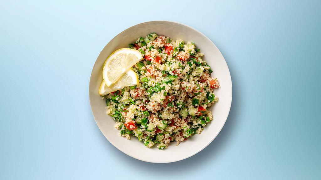 Levantine Tabbouleh · Fine Chopped parsley with tomatoes, onion, mint with burgul, lemon juice and olive oil.