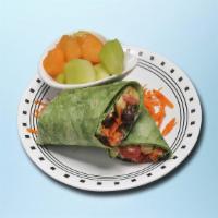 Easy Hummus Wrap · Fresh veggies wrapped to perfection with Hummus in a fresh-made pita with falafel pieces, to...