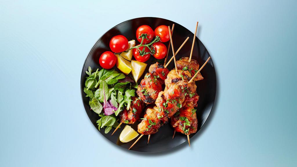 Chusky Chicken Kabob Plate · Chicken kabobs marinated served with house rice, steamed fresh mixed vegetables and salad