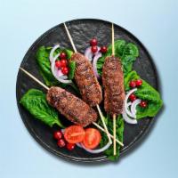 Lusty Lamb Kebab Plate · Succulent house spiced lamb kabobs served with house rice, steamed fresh mixed vegetables an...