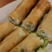 Mediterranean Cigars · Feta cheese and herbs wrapped in filo dough.