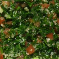 Tabouleh · Parsley, tomato, onion and cracked wheat. Tossed with lemon and olive oil.