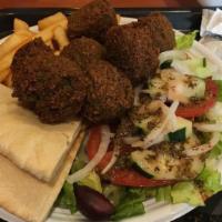 Falafel · Served with lettuce, tomato, pickles, and tahini.