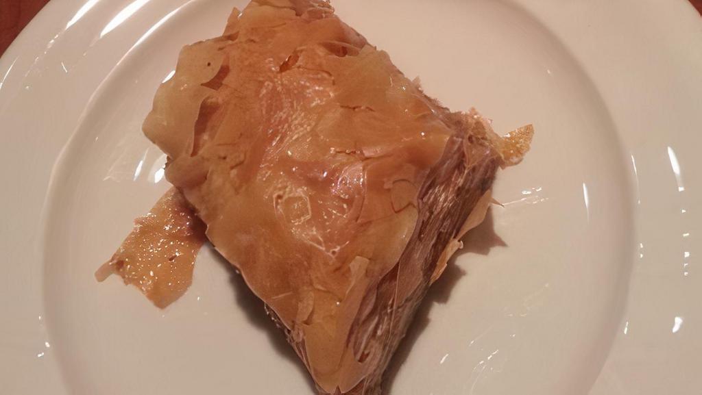 Baklava · Filo dough pastry stuffed with walnuts and draped in honey.