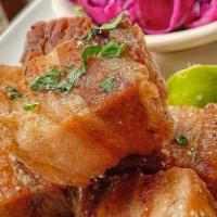 Chicharron · Cuban crispy pork belly served with tropical slaw.