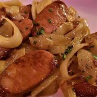 Chorizo Salteado · Artisanal Spanish sausage sautéed with onions, garlic and white wine.