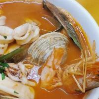 Levanta Muerto  · Seafood soup w/head on shrimp, mussels, clams and calamari in lightly spiced tomato broth