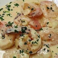Camarones Al Ajillo · Shrimp in creamy garlic sauce.