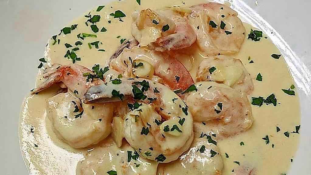 Camarones Al Ajillo · Shrimp in creamy garlic sauce.