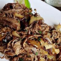 Vaca Frita · Crispy, twice cooked shredded flank steak and onions dressed with fresh lime juice.