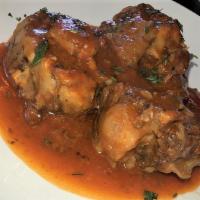 Rabo Encendido · Slow cooked oxtails in slightly spicy tomato sauce.