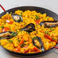  Seafood Paella / Paella De Mariscos  ( Large ) · Serves 2-3   Shrimp, scallops, squid, mussels, red pepper, sweet peas, saffron rice.