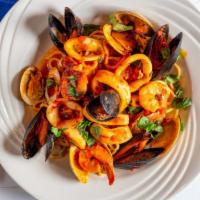 Pasta Chitarra Ionica · Calamari, Clams. Mussels, Shrimp light Tomato Sauce.