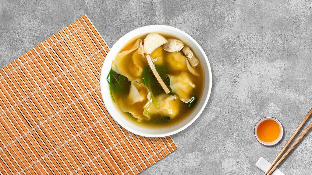 Wonton Soup · Wonton soup with pork and bean sprouts in a clear broth.