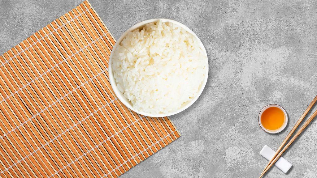 Steamed White Rice · Freshly steamed white rice.