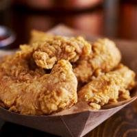 Chicken Strips · White chicken meat battered and fried to golden-brown perfection.