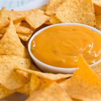 Nachos Cheese · Tortilla chips with melted cheese.