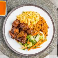 Oxtail · served with choice of Rice and 2 sides.