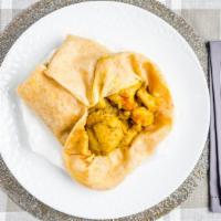 Curry Chicken Roti · Served with Potato and Channa