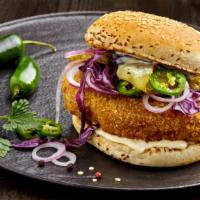 Hot Tenders Sandwich With Jalapeños · 2 Hot Tenders served on sliced bread with pickles, cole slaw, jalapeños and Tino's special s...