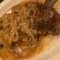 New York Steak · 10 oz. black pan-grilled steak with mushrooms, onions and a butter white wine sauce.