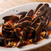 Cozze Al Pomodoro · Fresh mussels sautéed in tomato sauce.