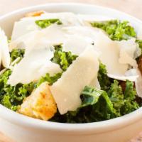 Insalata Kale Caesar · Kale salad, shaved Parmesan cheese, and croutons in a homemade caesar dressing.