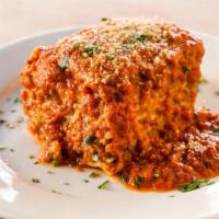 Lasagna · HOMEMADE pasta, layered with ground beef, besciamella, and tomato sauce.