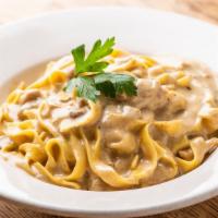 Fettuccine Ai Porcini · HOMEMADE fettuccine with imported porcini mushrooms cream sauce.