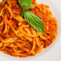 Spaghetti Al Pomodoro E Basilico · HOMEMADE spaghetti with plum tomato sauce and fresh basil.