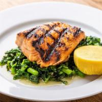 Salmone Alla Griglia · Grilled filet of salmon served with sauteed spinach.