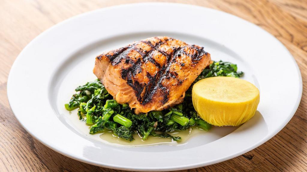 Salmone Alla Griglia · Grilled filet of salmon served with sauteed spinach.