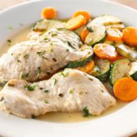 Pollo Al Limone · Sautéed chicken breast in lemon sauce served with sautéed zucchini and carrots.