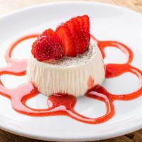 Panna Cotta Alle Fragole · Homemade pudding topped with strawberry.