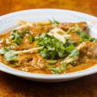 Chicken Karahi · Chicken pieces cooked with fresh tomatoes, green chiles, ginger and other spices and herbs.
