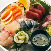 Sashimi With Spicy White Ponzu · Yellowfin tuna, Faroe Island salmon, fluke, and diver scallop.