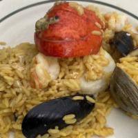 Paella A La Marinera With Lobster · Seafood, lobster, and rice.