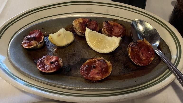 Clams Casino · Baked clams with hot tomato sauce.
