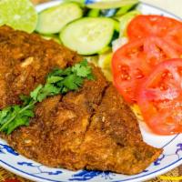 Fried Fish · With tiny tostones or fries.