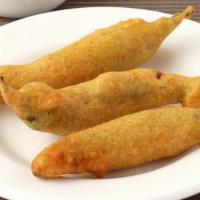 8 Pieces Masala Mirchi · Long hot peppers stuffed with potatoes and spices.