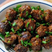 Vegetable Manchurian (Dry) · Golden fried vegetable koftas, tossed with onions and dry chili garlic sauce.