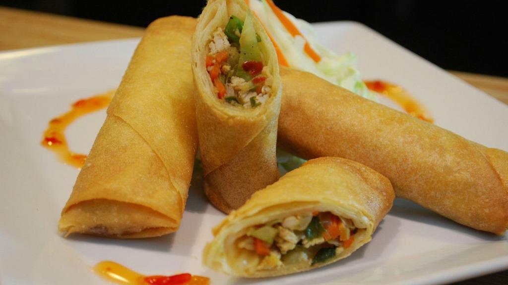 Chicken Spring Rolls · Crispy golden fried spring rolls with sweet chili sauce.