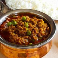 Lamb Keema Muttor · Minced lamb with peas, onions and eggs.
