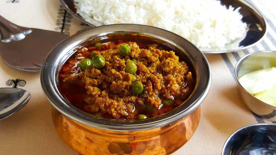 Lamb Keema Muttor · Minced lamb with peas, onions and eggs.