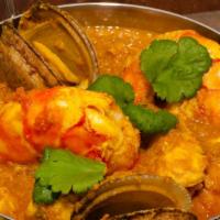 Fish Goan Curry · Filet of fresh fish with ginger, garlic, mustard seed, curry leaf and coconut milk.