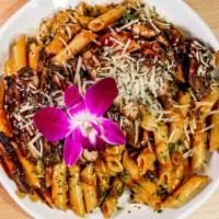 Jerk Chicken Rasta Pasta · Penne tossed in with carrots, broccoli, cream, jerk sauce, shredded Parmesan  cheese and bon...
