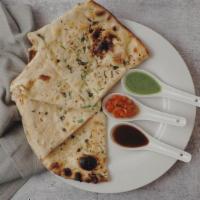 43,Chilly Garlic Naan · Light and fluffy authentic Indian bread baked with chilly,garlic and cilantro.
