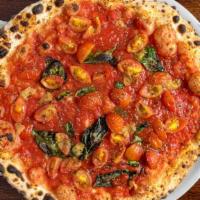 Marinara Pizza · Tomato sauce, sauteed cherry tomatoes, roasted garlic, and basil.