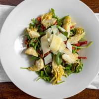 Tutt’Appost Salad · Arugula, shaved Parmigiano, sun-dried tomatoes, and marinated artichokes with housemade dres...